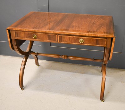 Lot 372 - A reproduction mahogany sofa table with two...