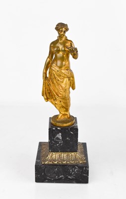 Lot 238 - An 18th century gilt bronze figure of a woman...