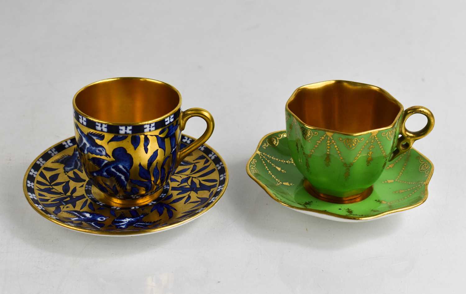 Lot 139 - Two Coalport porcelain cups and saucers, one...