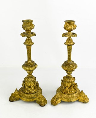 Lot 274 - A pair of 19th century gilt metal candlesticks,...