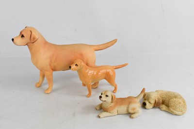 Lot 141 - Two Beswick labradors, one a/f, together with...