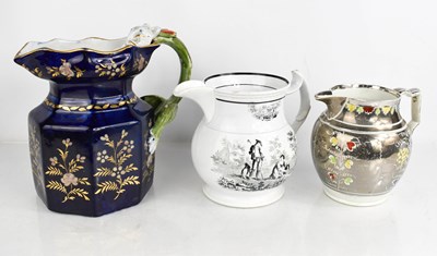 Lot 144 - A three 19th century jugs , one with a blue...