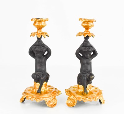 Lot 278 - A pair of 19th century cherub candlesticks...