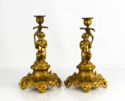 Lot 280 - A pair of 19th century brass cherub form...