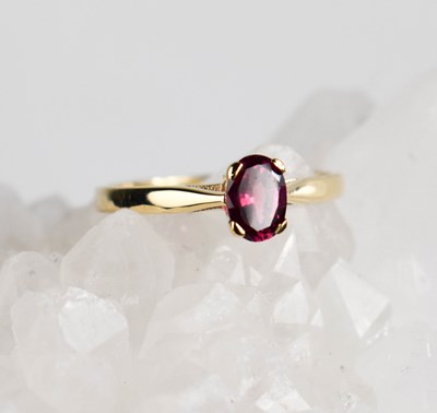 Lot 421 - A 9ct gold and ruby ring, the oval ruby in a...