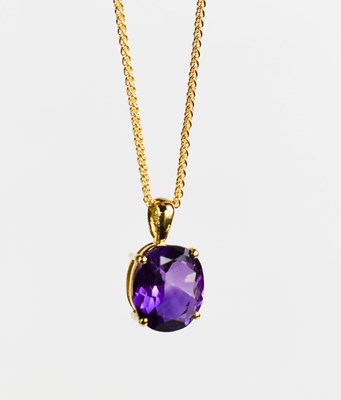 Lot 453 - An 18ct gold and amethyst pendant, with a 9ct...