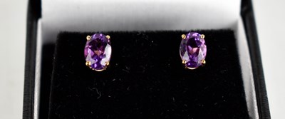 Lot 394 - A 9ct gold oval amethyst stud earrings.