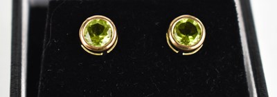 Lot 376 - A pair of 9ct gold and peridot stud earrings.