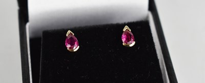 Lot 435 - A pair of 18ct gold and ruby pair shaped...