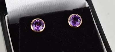 Lot 384 - A pair of 9ct gold and amethyst stud earrings.