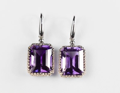 Lot 437 - A pair of 18ct white gold and amethyst drop...