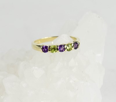 Lot 405 - A 9ct gold, amethyst and peridot five stone...