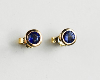 Lot 403 - A 9ct gold and sapphire pair of stud earrings.