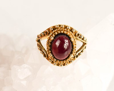 Lot 393 - A 9ct gold vintage cabochon amethyst ring,...