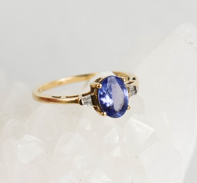 Lot 392 - A 9ct gold, tanzanite and diamond ring, size P,...