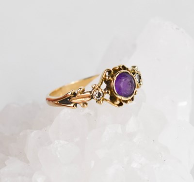 Lot 377 - A 9ct yellow gold, amethyst and diamond ring,...