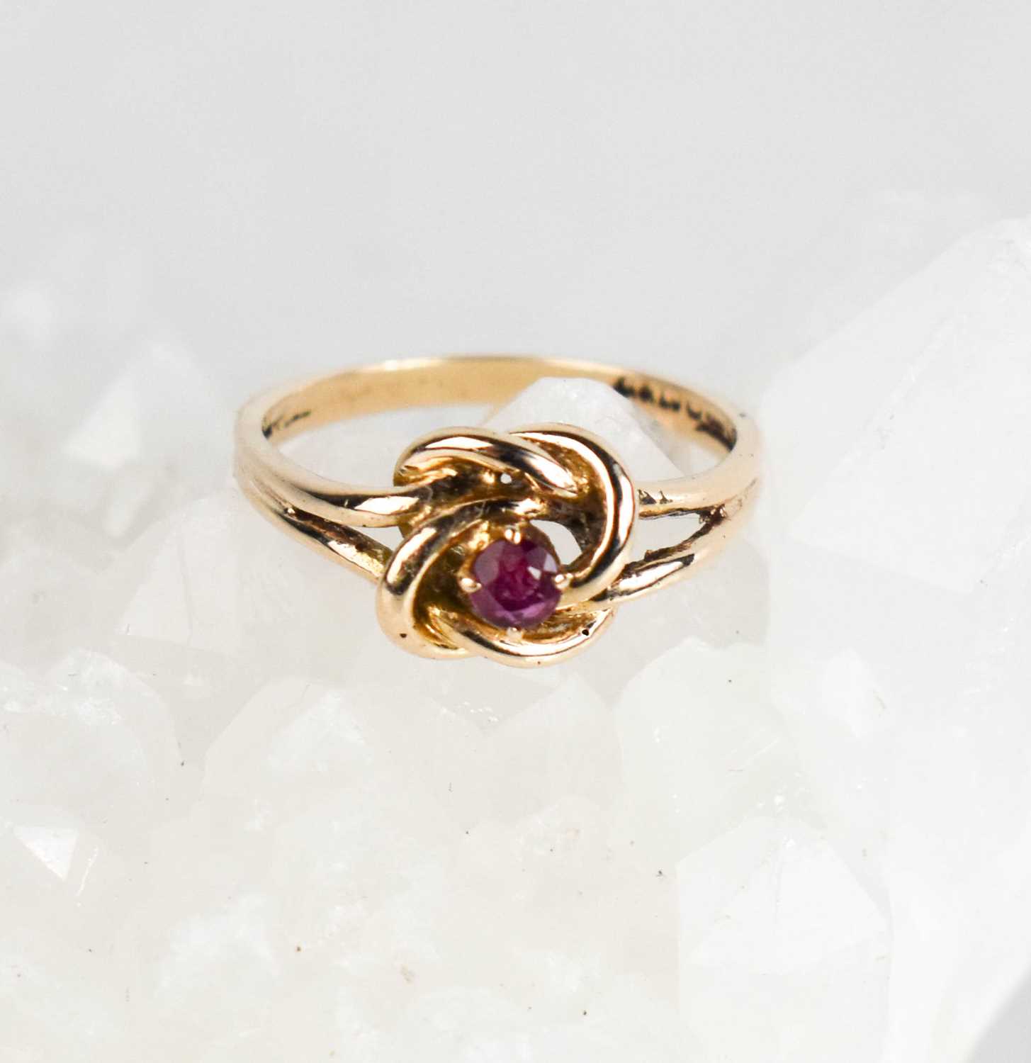 Lot 386 - A 9ct gold vintage knot ring, set with rubies,...