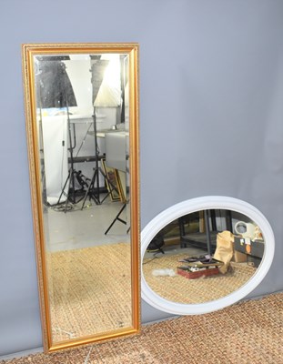 Lot 282a - A large oval framed painted wall mirror...