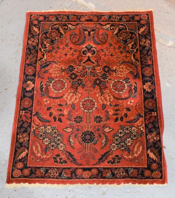 Lot 385a - A Samarkland red ground rug with stylised...