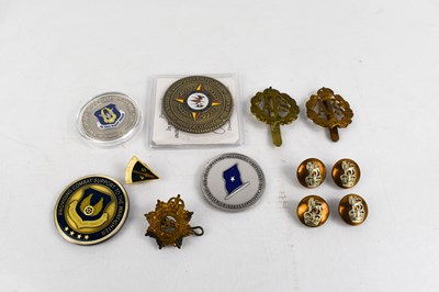 Lot 32 - A groupo of medals, military badges, and...