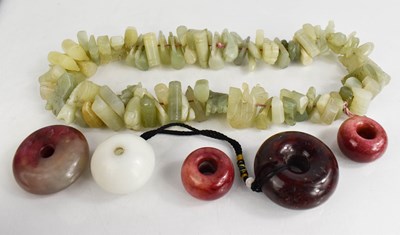 Lot 265 - A string of intricately carved Chinese jade...