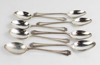 Lot 11 - A set of eight silver teaspoons, with beaded...
