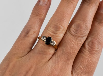 Lot 47 - An 18ct gold, diamond and sapphire ring, the...