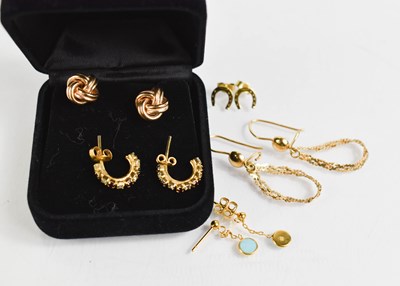 Lot 381 - A pair of 18ct gold earrings, the loops above...