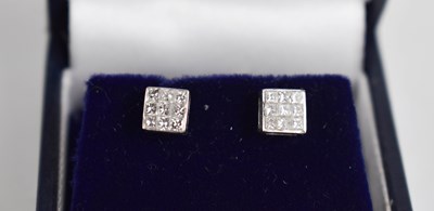 Lot 425 - A pair of 14ct diamond princess cut nine stone...