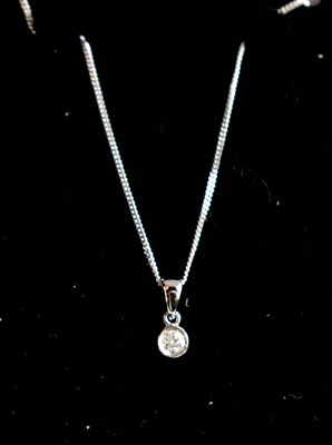 Lot 412 - A 9ct gold diamond pendant and chain.