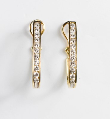 Lot 447 - A pair of 14ct gold (tested as) and diamond...