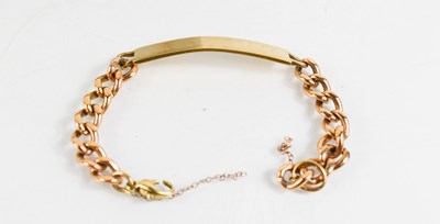 Lot 429 - A 9ct gold curb link name bracelet, the curved...