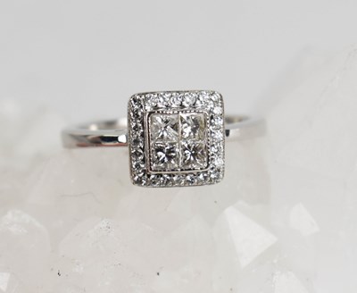 Lot 442 - An 18ct white gold princess cut and brilliant...