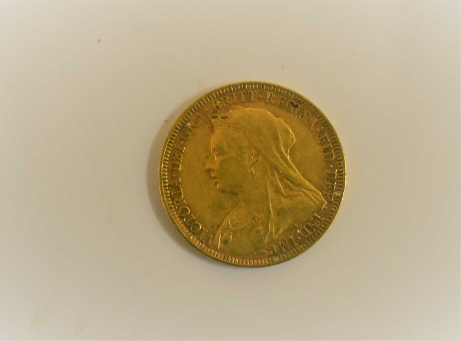 Lot 127 - A Victoria full gold sovereign dated 1894 and...