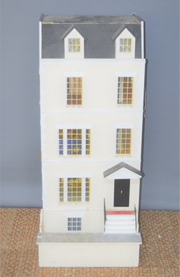 Lot 317 - A large wooden dolls house, modelled as a four...