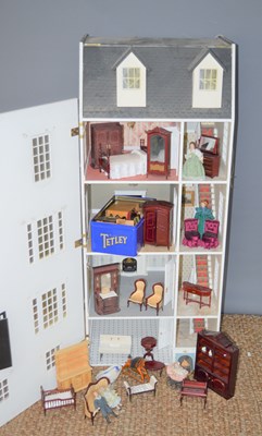 Lot 317 - A large wooden dolls house, modelled as a four...