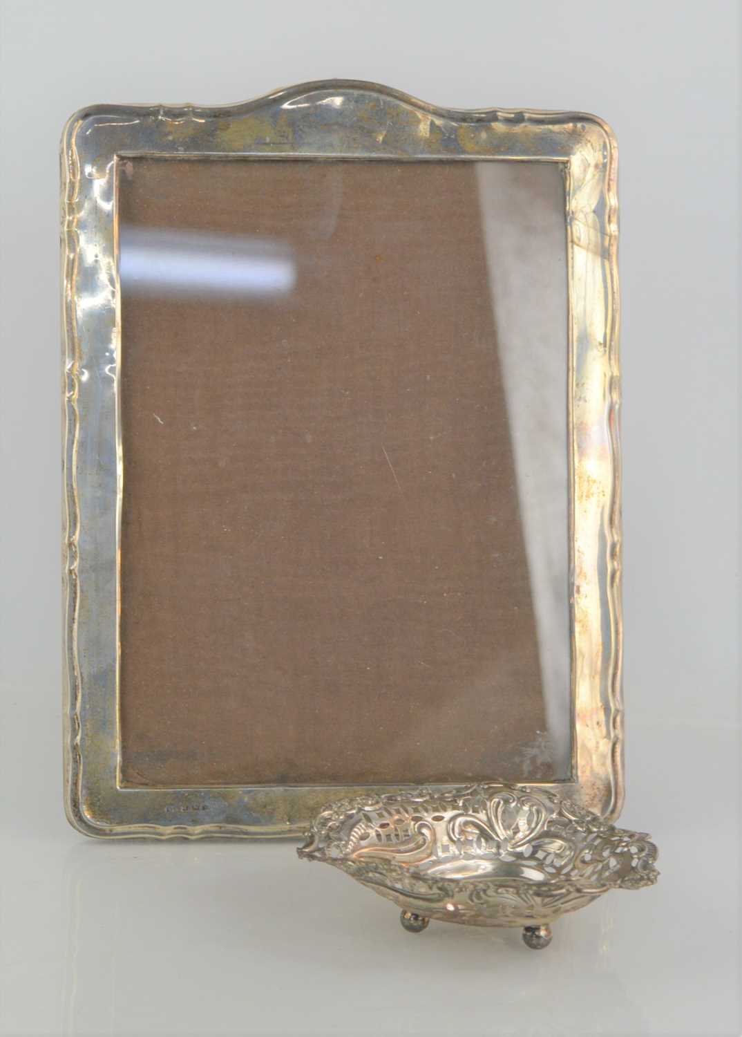 Lot 10 - A 1940s silver photograph frame together with...