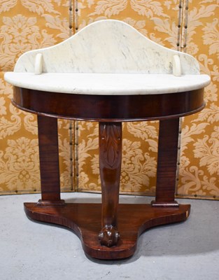 Lot 445 - A Victorian mahogany marble top demi-lune wash...