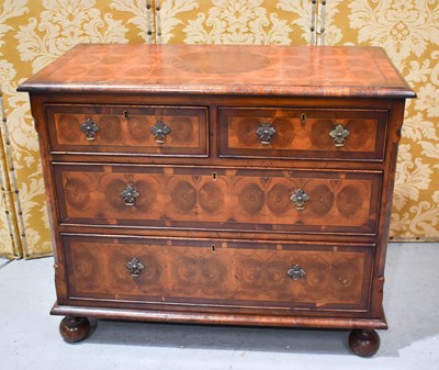 Lot 455 - A reproduction walnut oyster veneered chest of...