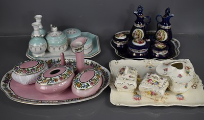 Lot 191 - A group of vintage pottery dressing table sets,...