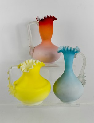 Lot 102 - Three vintage opaque glass jugs, each in...