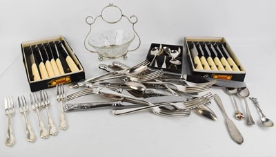 Lot 39 - A group of flatware to include sets of knives,...