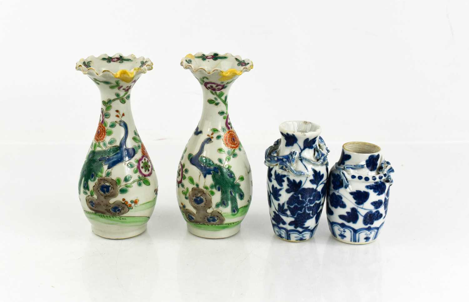 Lot 281 - Two Chinese blue and white bud vases, modelled...