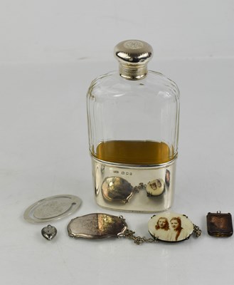 Lot 54 - A silver and glass hip flask, the silver lid...