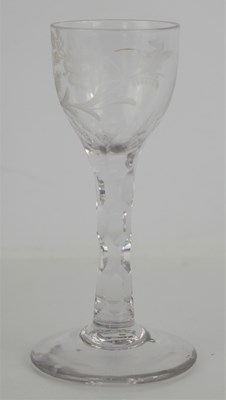 Lot 99 - A 19th century sherry glass with faceted stem...