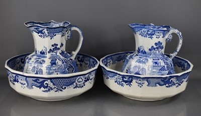Lot 125 - Two large Victorian blue and white was jugs...