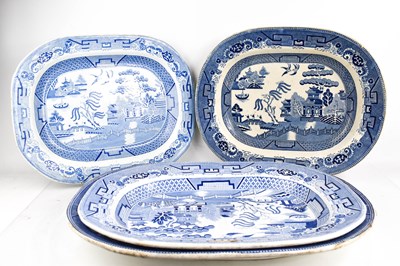 Lot 111 - Four Victorian Willow pattern meat platters in...