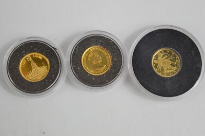 Lot 375 - A group of eleven gold proof miniature $10...