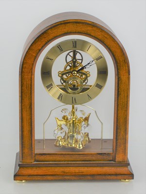 Lot 262 - A Harmony mahogany cased skeleton clock.