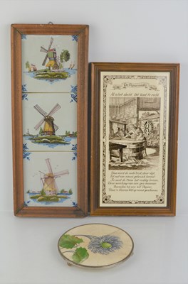 Lot 180 - A framed group of three Dutch delft tiles made...